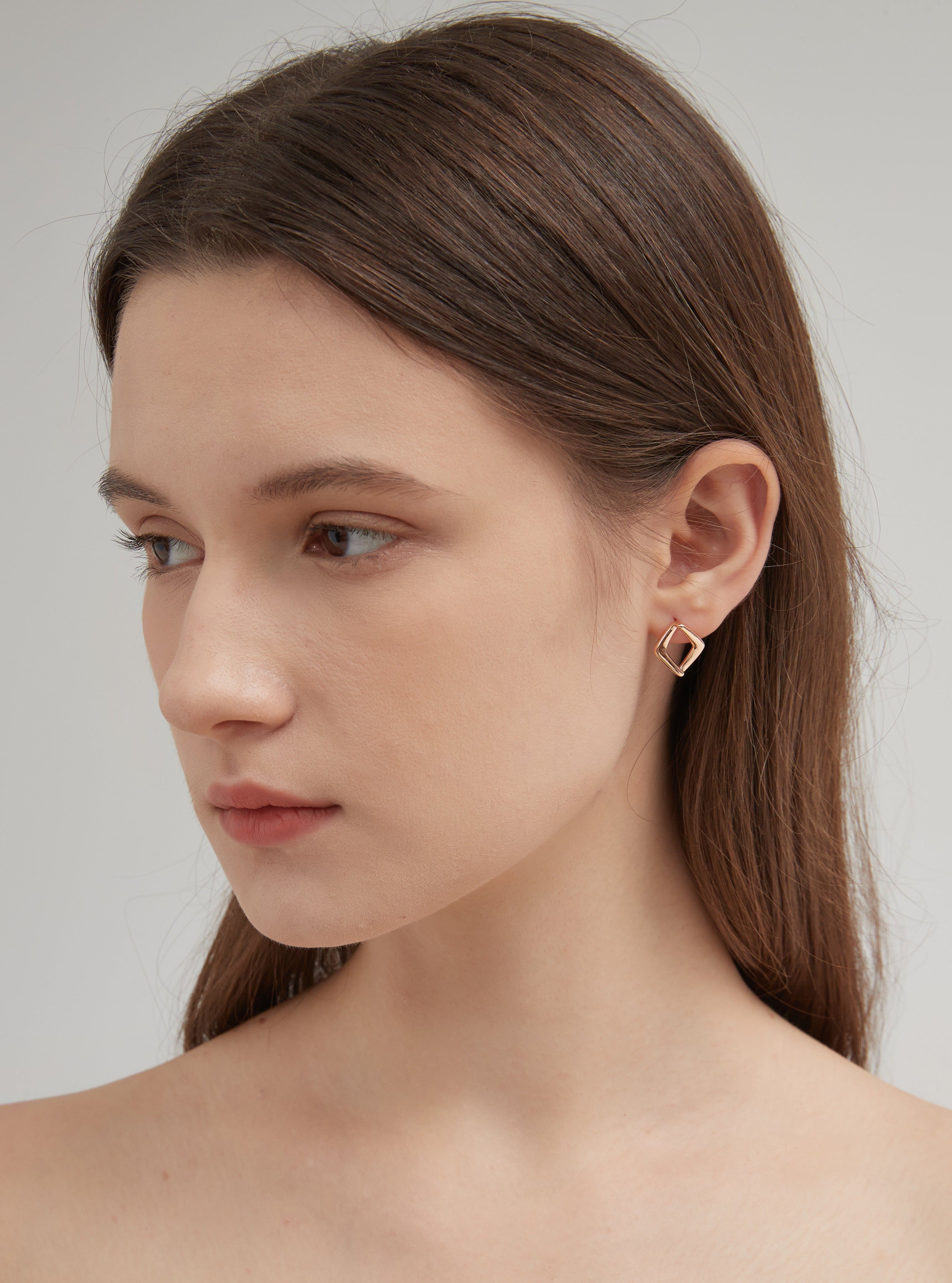 STMG Minimalist Rhombus Stud Earrings on ear