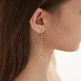 STMG Spiral Wave Dangle Threader Earrings in gold on ear