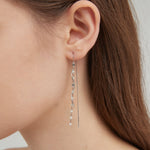 STMG Spiral Wave Dangle Threader Earrings in silver on ear