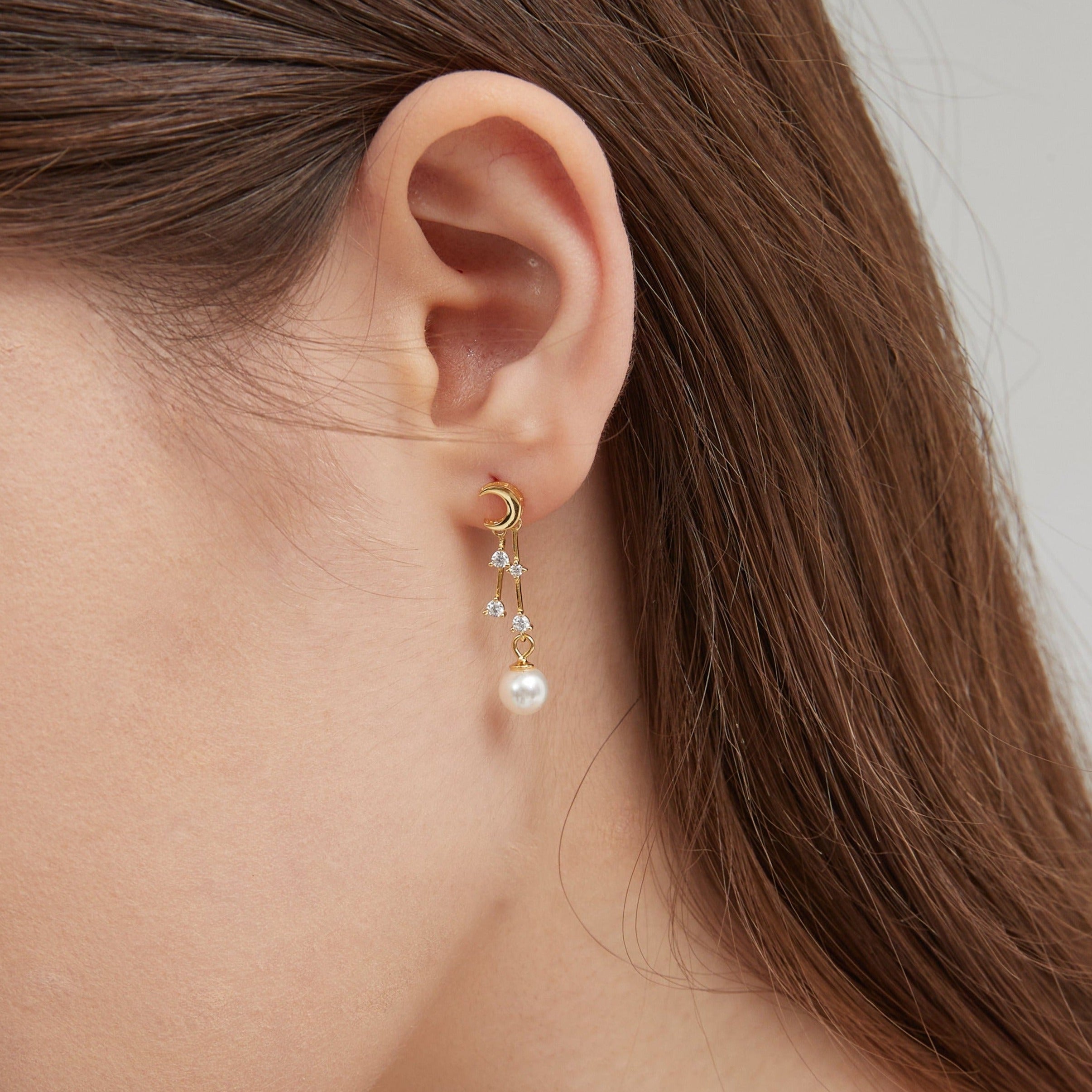 STMG Moon with Stars Pearl Earrings on ear