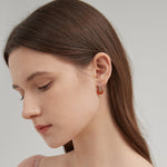 STMG Natural Stone Hoops on ear