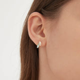 Blue Leaf Stud Earrings in gold on ear