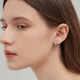 Blue Leaf Stud Earrings in silver on ear