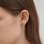 Black Bat Stud Earrings on ear