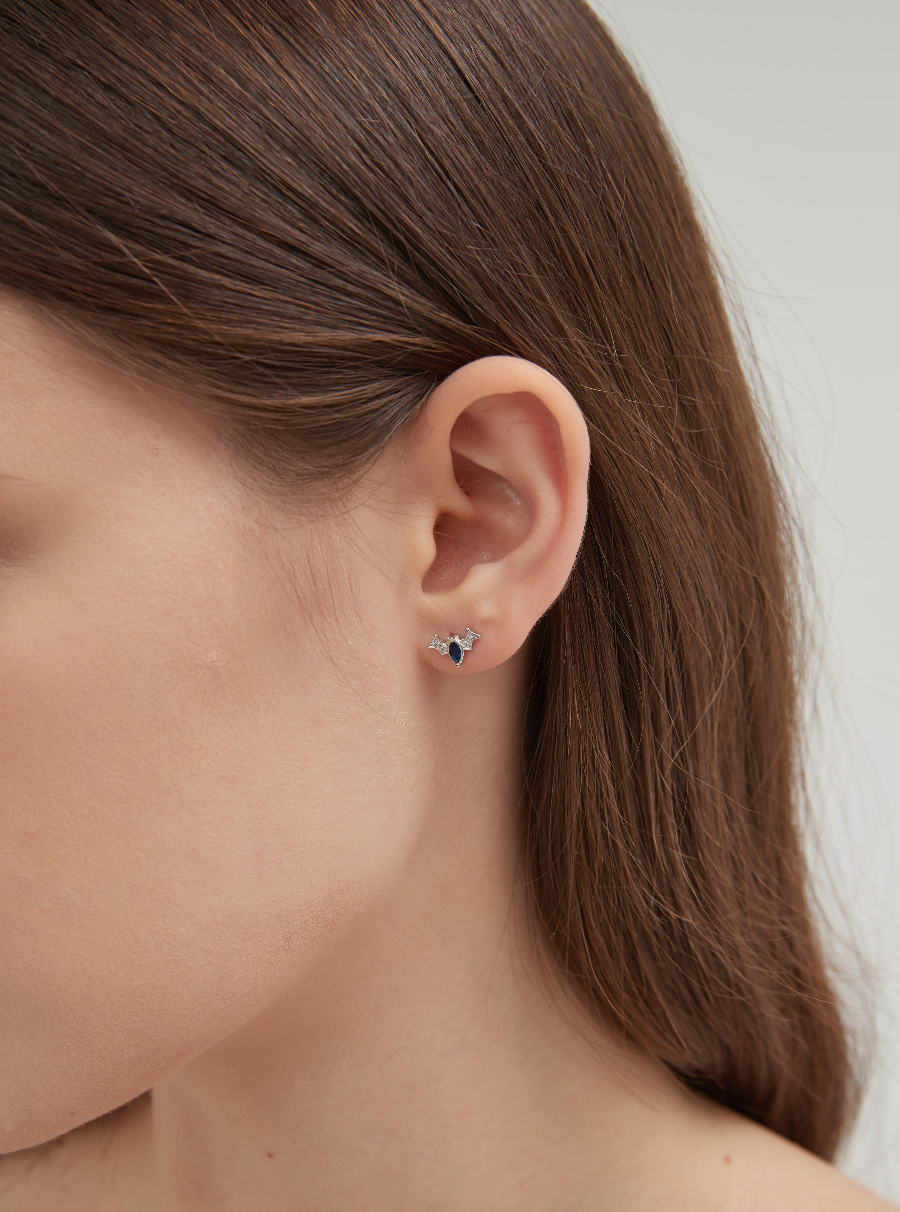 Black Bat Stud Earrings on ear