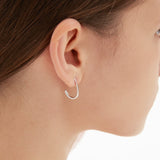 Droplet Hook Earrings in silver on ear