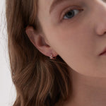 STMG Olive Leaf Hoops in rose gold on ear