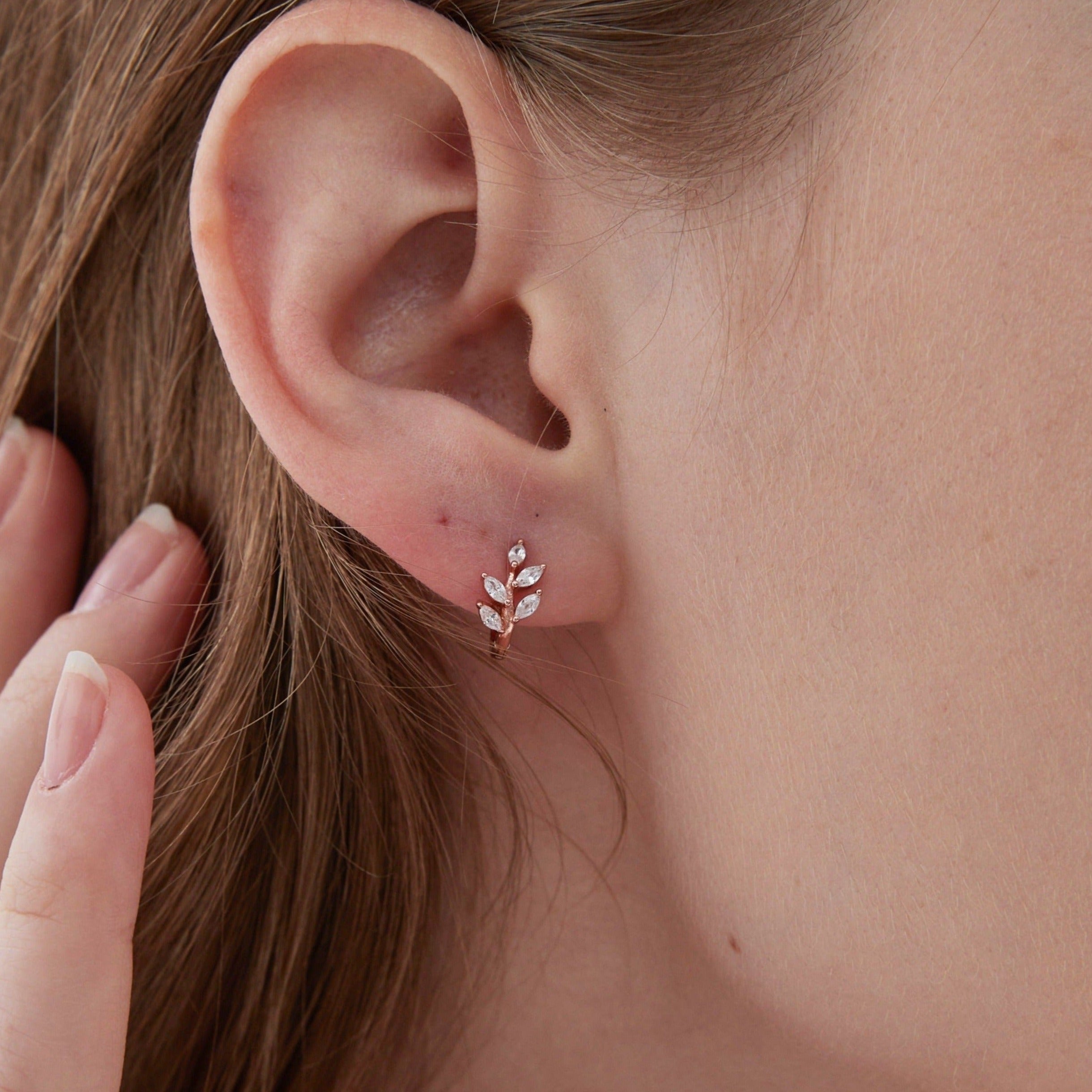 STMG Olive Leaf Hoops in rose gold on ear