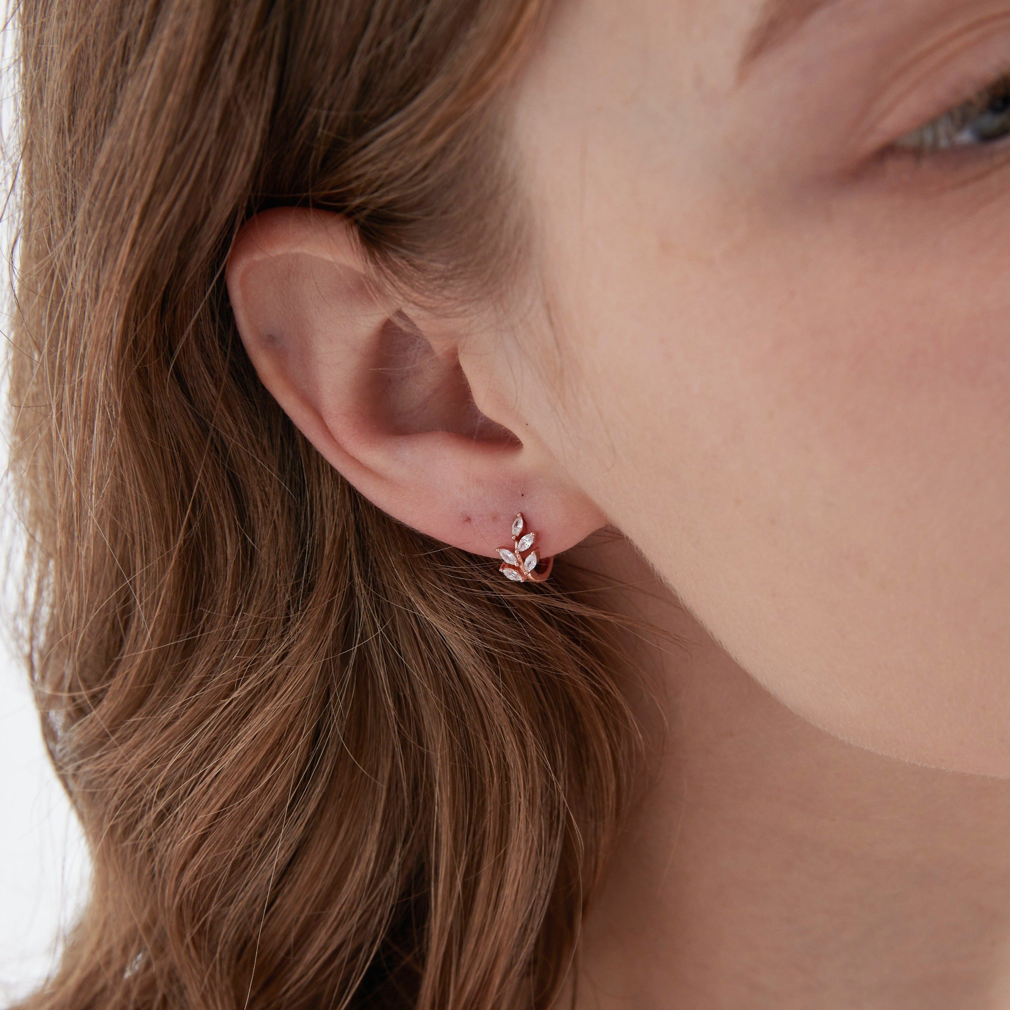 STMG Olive Leaf Hoops in rose gold on ear