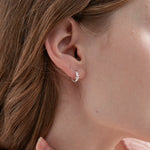 STMG Olive Leaf Hoops in silver on ear