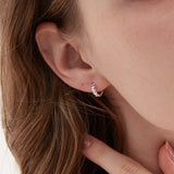 STMG Olive Leaf Hoops in silver on ear