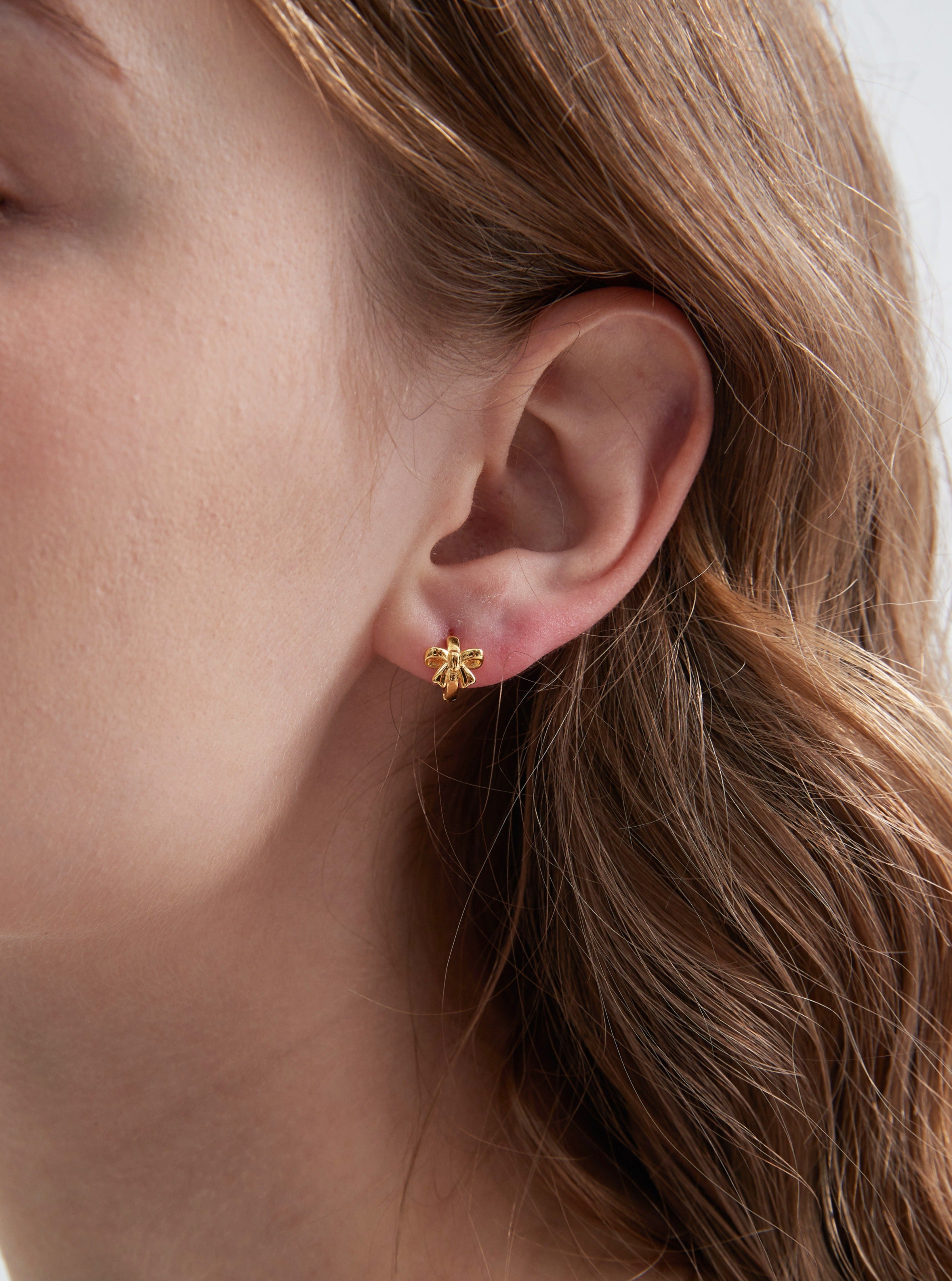 STMG Minimalist Bowknot Hoops in gold on ear