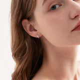 STMG Minimalist Bowknot Hoops in silver on ear