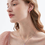 STMG Pink Heart Hoops on ear with matching necklace on neck