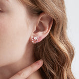 Flower Wreath Stud Earrings in rose gold on ear