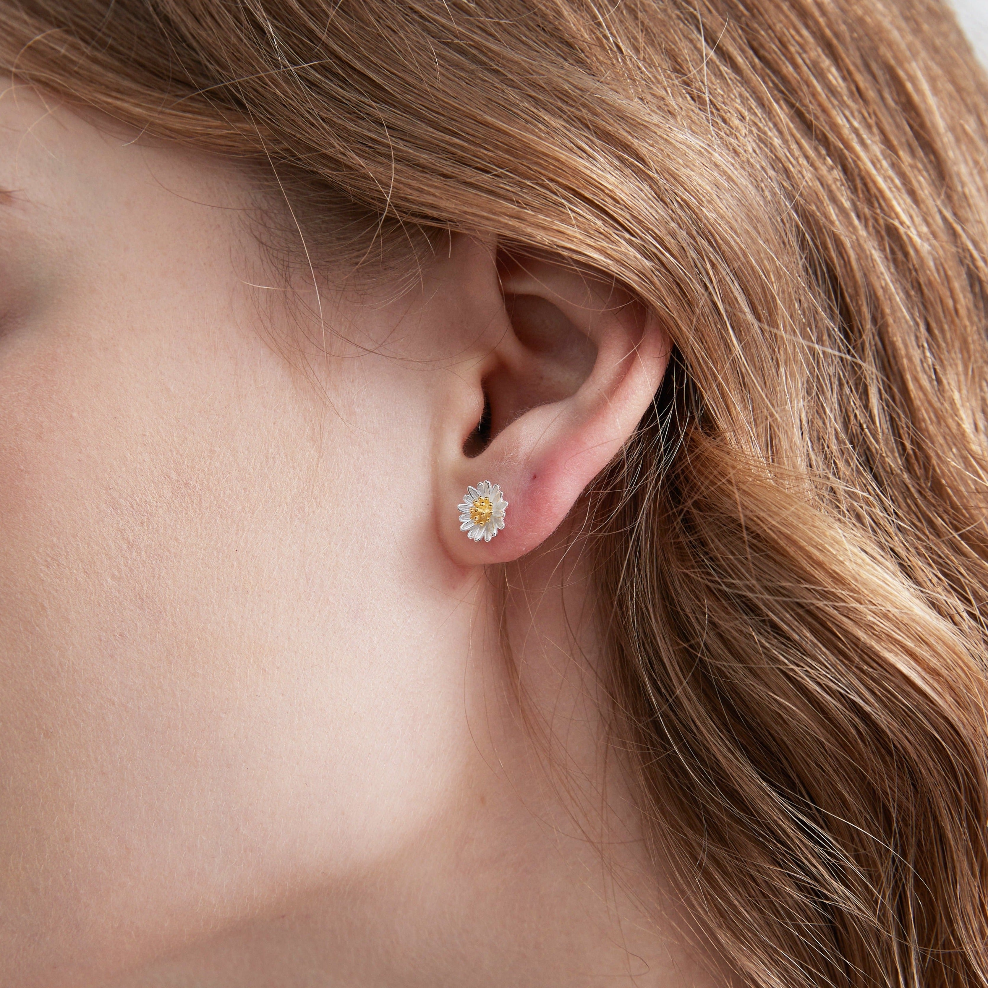 STMG Tiny Daisy Stud Earrings on ear