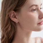 STMG Tiny Butterfly Stud Earrings on ear