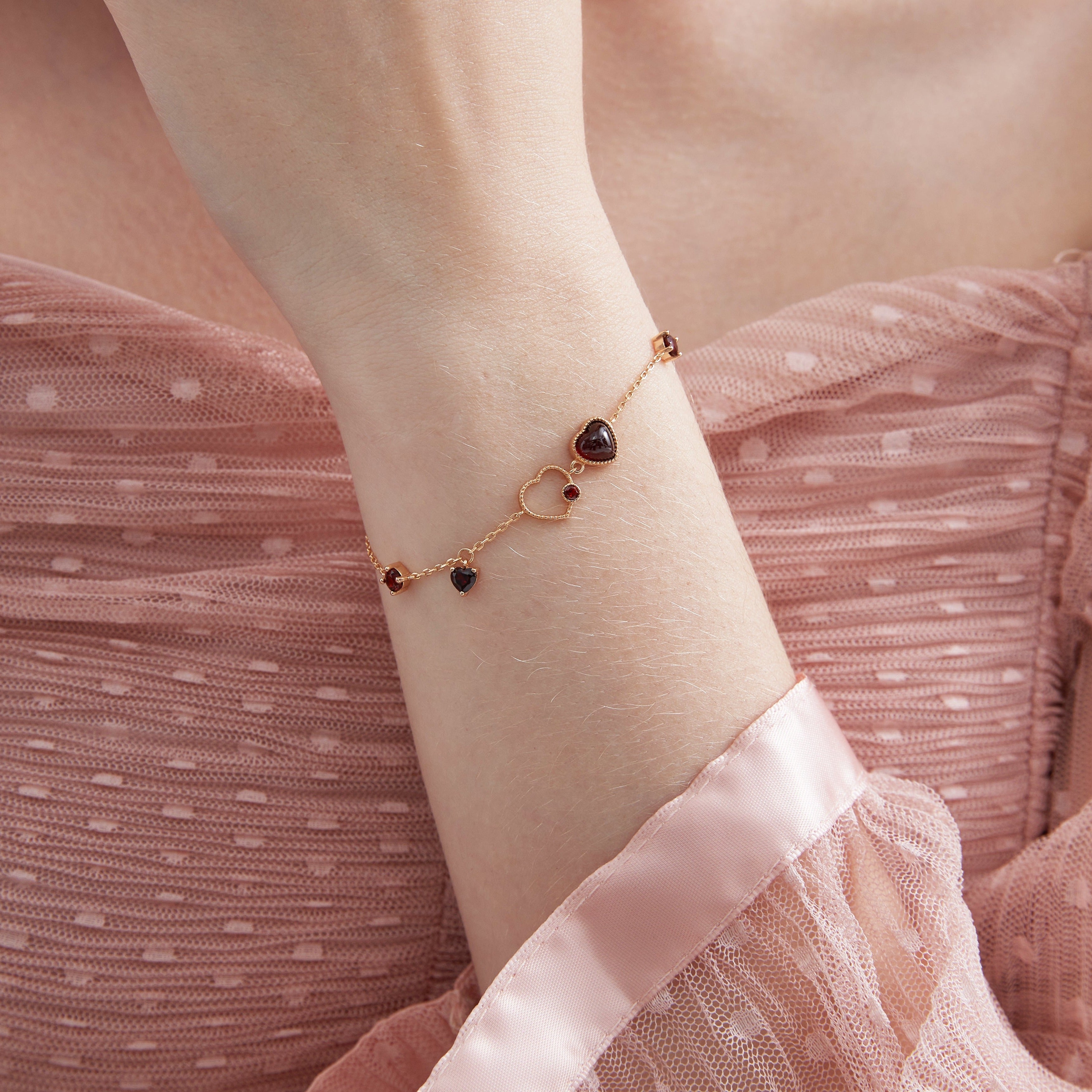 STMG Natural Garnet Heart Bracelet on hand