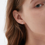 STMG Star Stud Earrings on ear