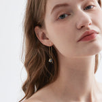 STMG Moon and Star Threader Earrings in gold on ear