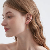 STMG Moon and Star Threader Earrings in gold on ear