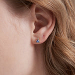 Blue Sapphire Stud Earrings on ear