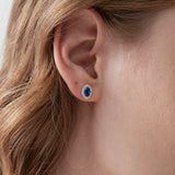 Blue Sapphire Stud Earrings on ear