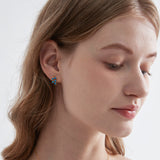 Blue Opal Olive Leaf Stud Earrings on ear