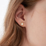 STMG Natural Pearl Stud Earrings on ear