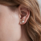 STMG Pearl Stud Earrings in silver on ear