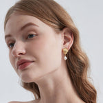 STMG Natural Pearl Dangle Earrings on ear