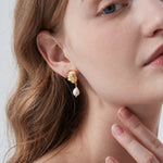 STMG Natural Pearl Dangle Earrings on ear