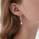 STMG Freshwater Pearl Drop Earrings in silver on ear