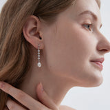 STMG Freshwater Pearl Drop Earrings in silver on ear