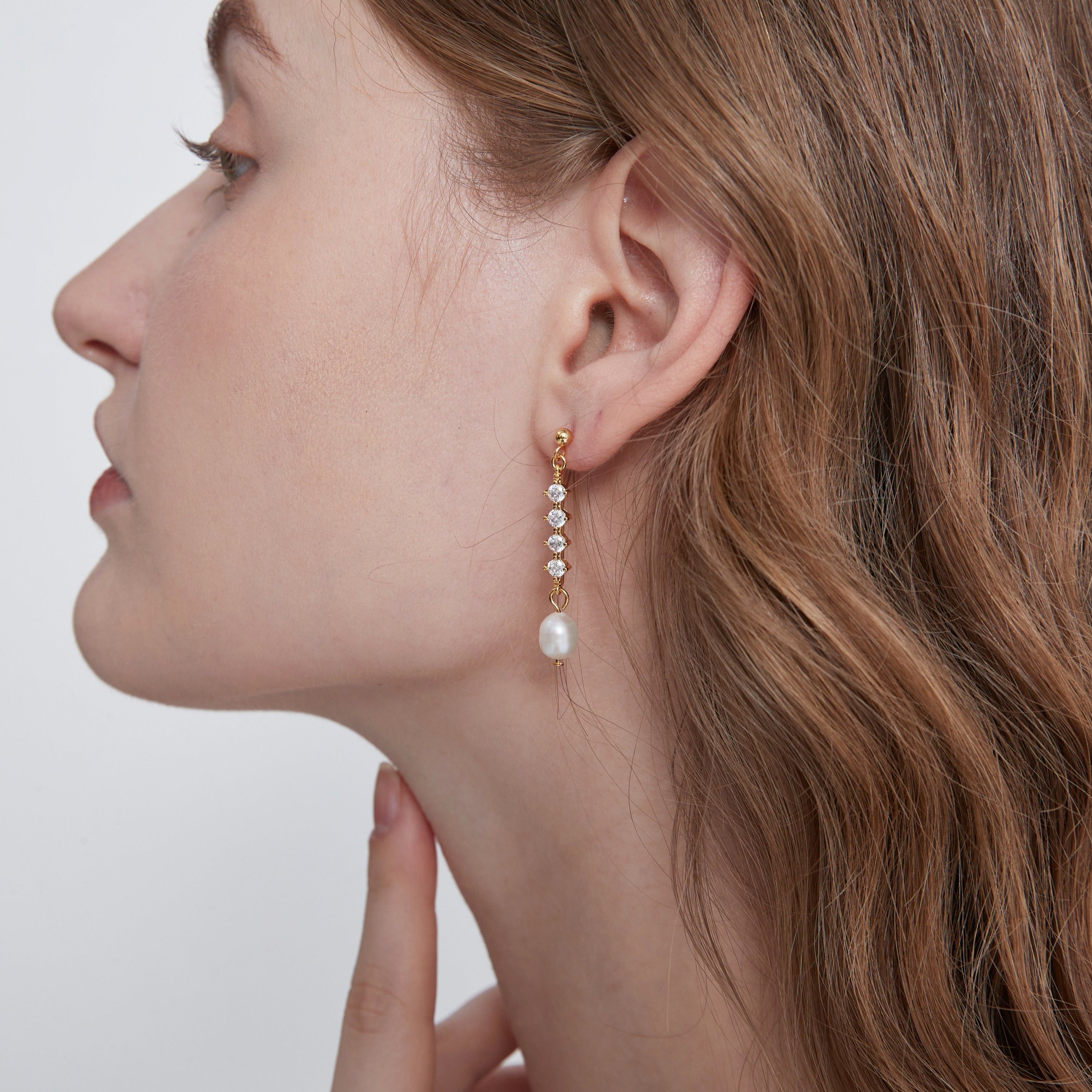 STMG Freshwater Pearl Drop Earrings in gold on ear