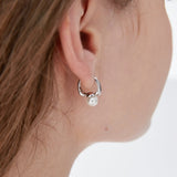 STMG Minimalist Pearl Hoops in silver on ear