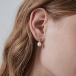 STMG Natural Pearl Dangle Earrings on ear