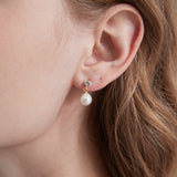 STMG Natural Pearl Dangle Earrings on ear