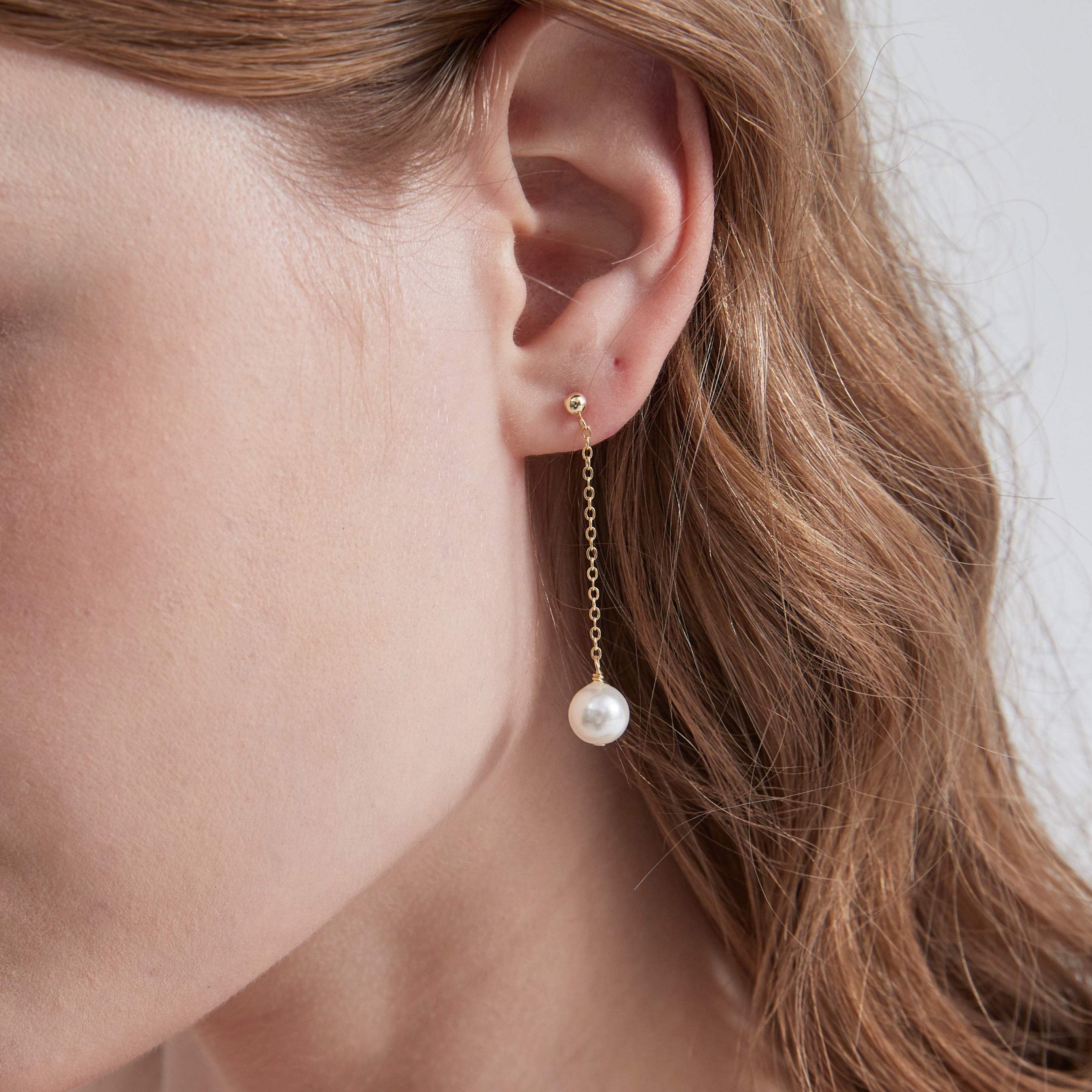 STMG Pearl Drop Dangle Earrings on ear