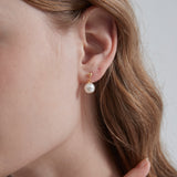 STMG Pearl Dangle Earrings in gold on ear