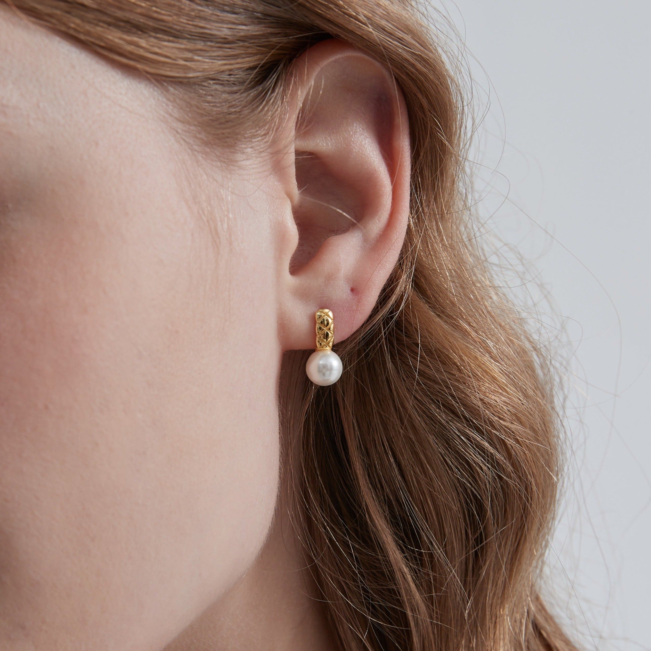 STMG Pearl Stud Earrings on ear