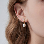 Butterfly Pearl Dangle Earrings on ear