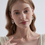 STMG Pearl Wreath Dangle Hoops on ear