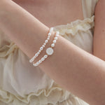 STMG Natural Pearl with Mother of Pearl Rose Bracelet on hand