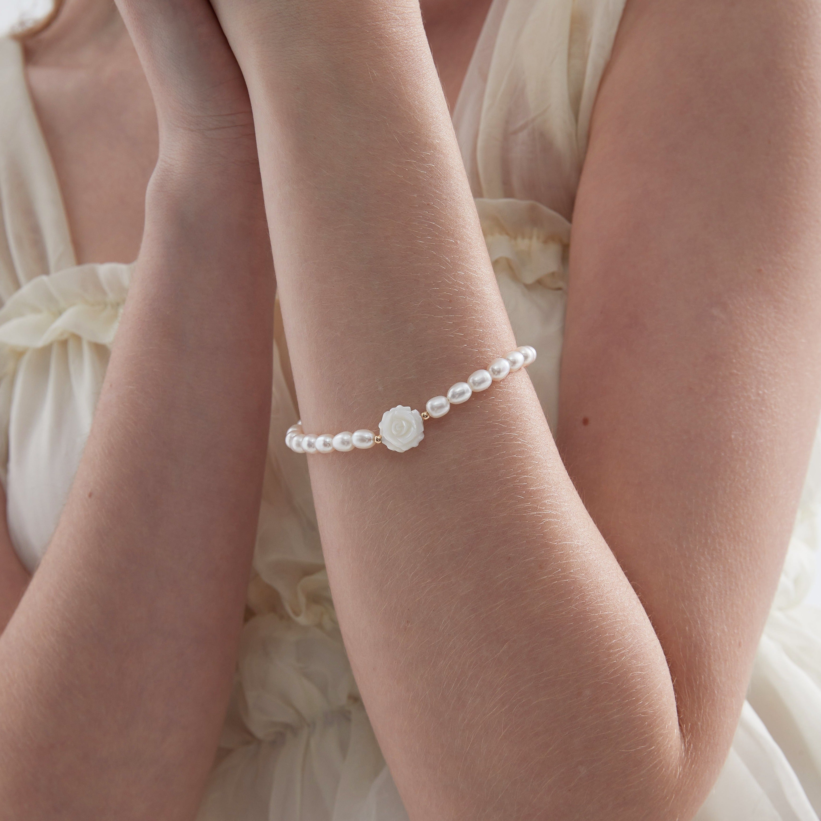 STMG Natural Pearl with Mother of Pearl Rose Bracelet on hand