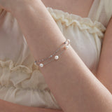 Duo Layer Natural Pearl Bracelet in silver on hand