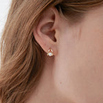 STMG Pearl Droplet Stud Earrings in gold on ear