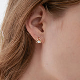 STMG Pearl Droplet Stud Earrings in gold on ear