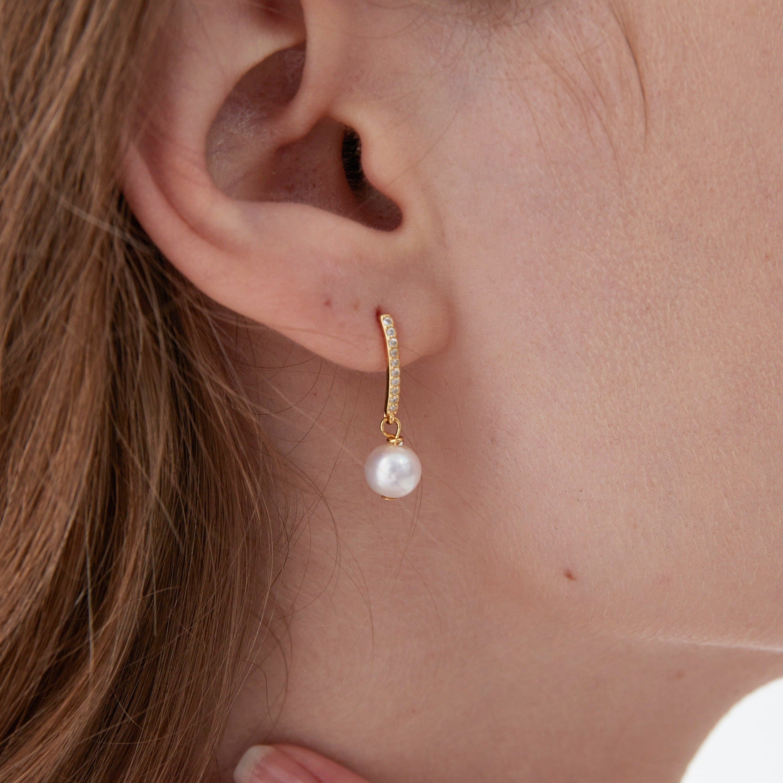 STMG Natural Pearl Dangle Earrings on ear