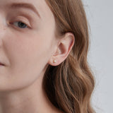 STMG Tiny Pearl Stud Earrings on ear